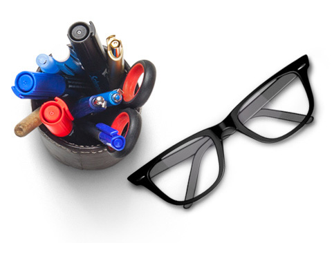 a pencil holder and glasses