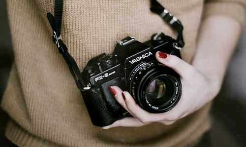 woman holding a camera